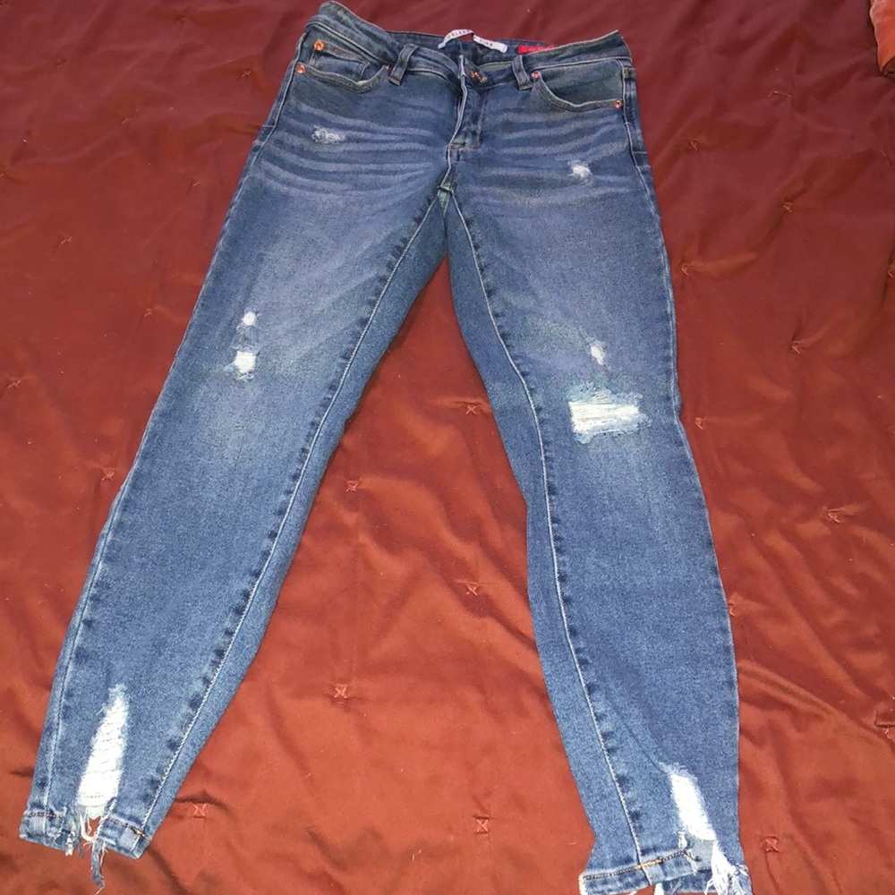 Low rise distressed skinny jeans